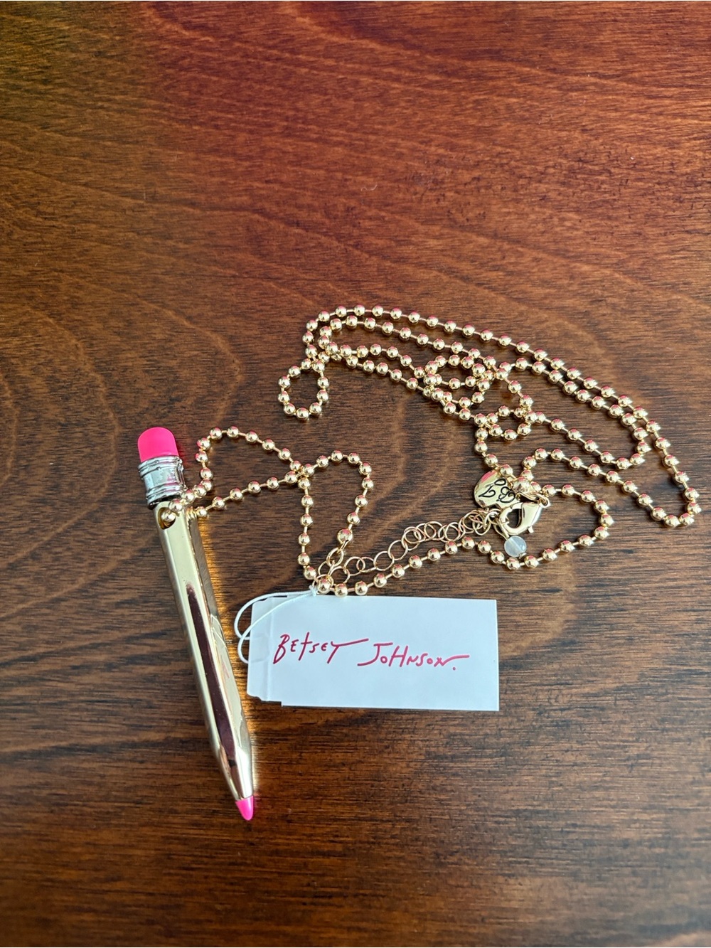 Betsey Johnson Gold Tone Necklace with Hot Pink Pencil Charm